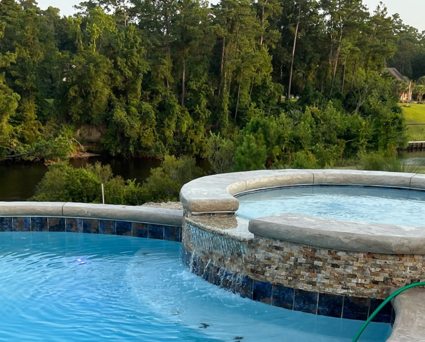A custom gunite concrete pool with a circular, two-tier design. Constructed in South Carolina.